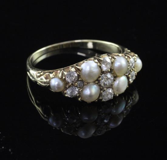 An Edwardian gold, split pearl and diamond cluster ring, size O.